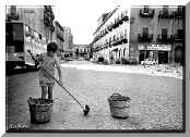 A boy sweeping pumpkin seed